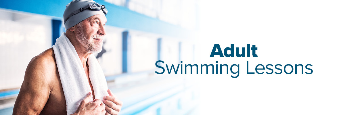 An older man with swimming cap and goggles on, stood by a pool. Text on the image reads: Adult Swimming Lessons